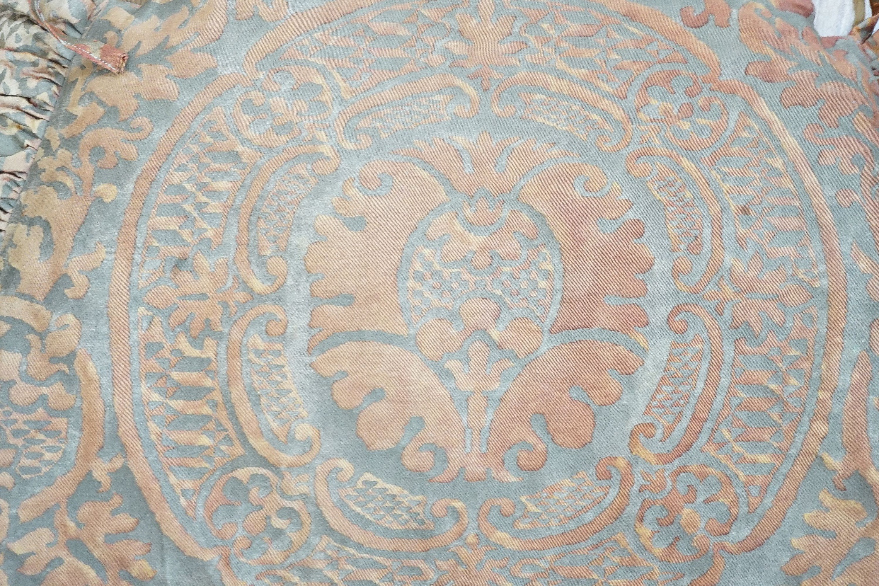 A pair of Fortuni 'Orsini pattern' seat cushions in rust and gold colourway